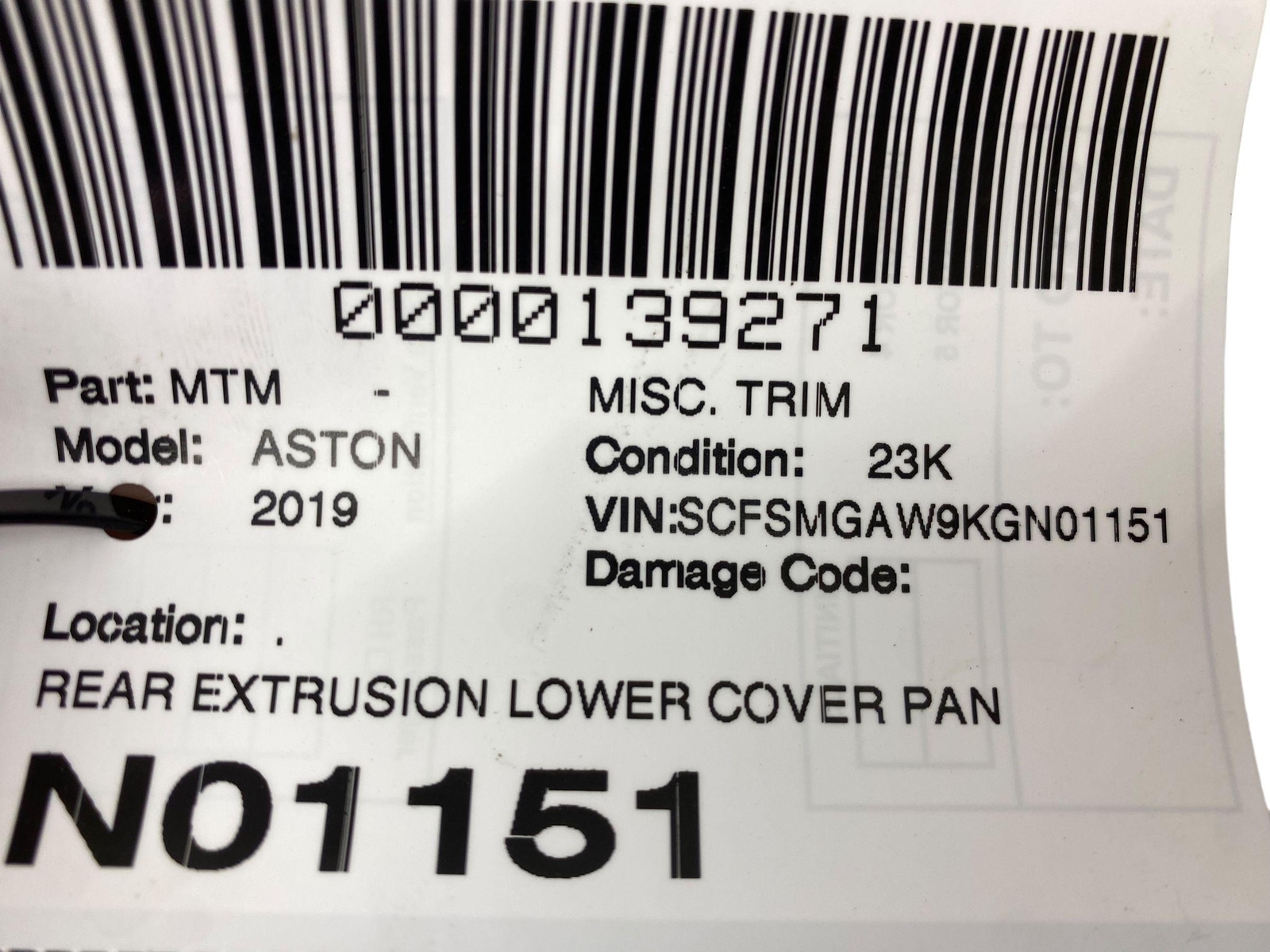 2019 ASTON MARTIN VANTAGE OEM REAR EXTRUSION LOWER TRIM COVER *CREASES/INDENT*