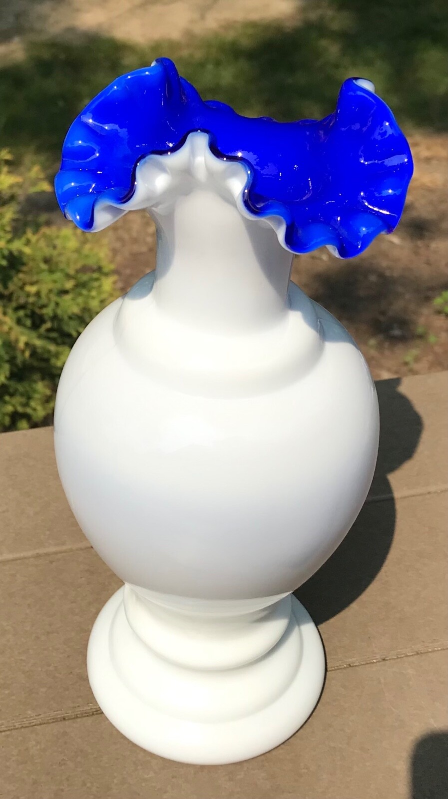 Fenton white pre logo vase with cobalt blue inside from Fentons