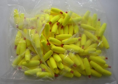 Comal C150-Y-100 1-1/2'' x 1/2'' Yellow Torpedo Float W/Pegs Inserted Bag of 100