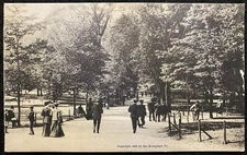 1905c *DRESSED UP PEOPLE WALKING DOWN STREET*  REAL PHOTO POSTCARD (ROTOGRAPH)!