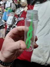small plastic bubble blower, likely a 60 ml bottle
