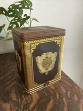 Vintage JL Clark Manufacturing Co. Tin Canister w/ Coat of Arms, Gold/Brown 6.5”