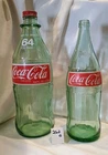 2 Vintage Coca Cola Bottles. A 64 Ounce And A 32 Ounce. Empty.