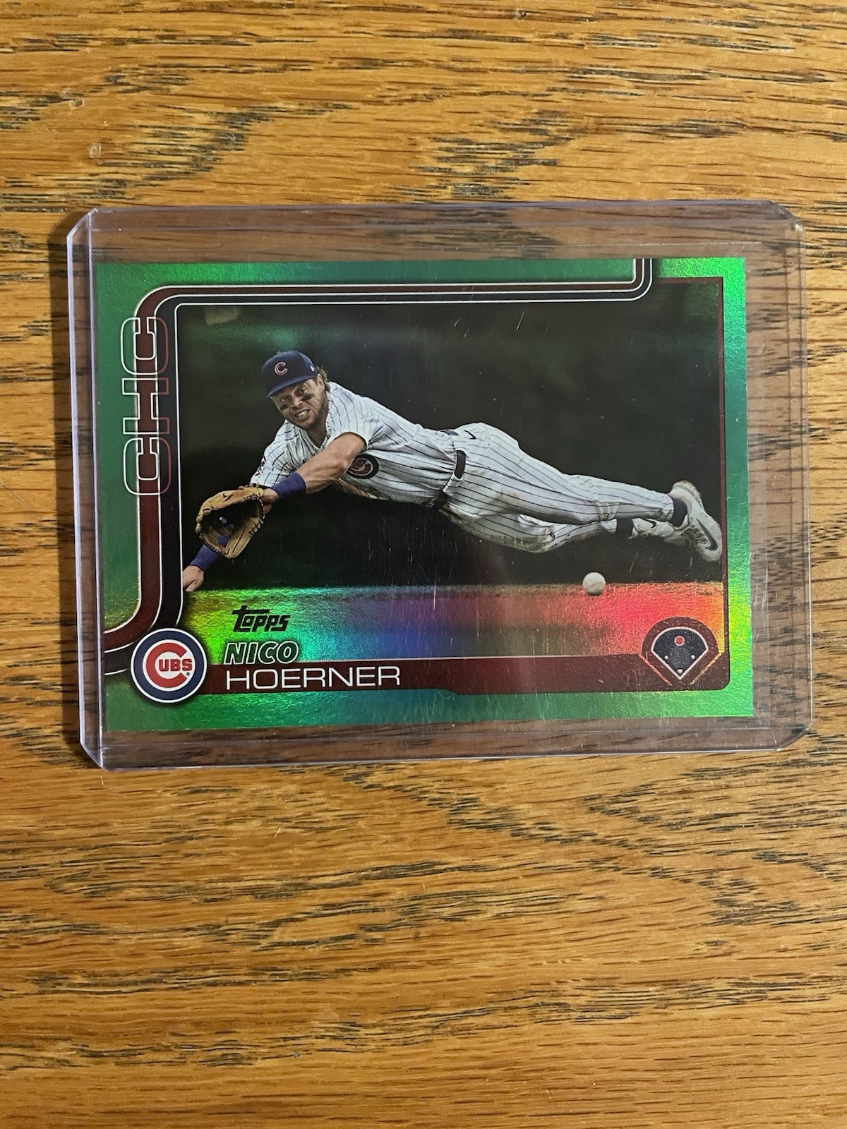 2025 Topps Series 1 Nico Hoerner #38 Green Holo Foil /99