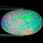 5.17 Ct IGI Certified Natural Ethiopian Opal Multi Color Oval Cabochon Cut — photo 1
