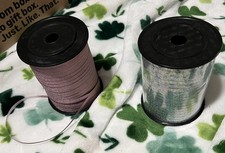 1 500 yards silver ribbon and partial glitter pink ribbon