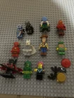 lot of 11 lego minifigures DC, TMNT, cmf, toy story, star wars