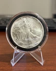 1994 Silver American Eagle $1 - BU. Capsule Scratch Coin Is Perfect Toning