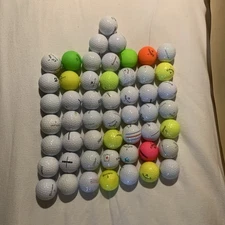 Assorted brands GOLF BALLS some with corporate logos, some with player markings.