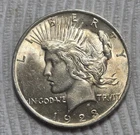 1923 Peace Silver Dollar. Estimated Almost Uncirculated 58. Toner & Crack. A0525