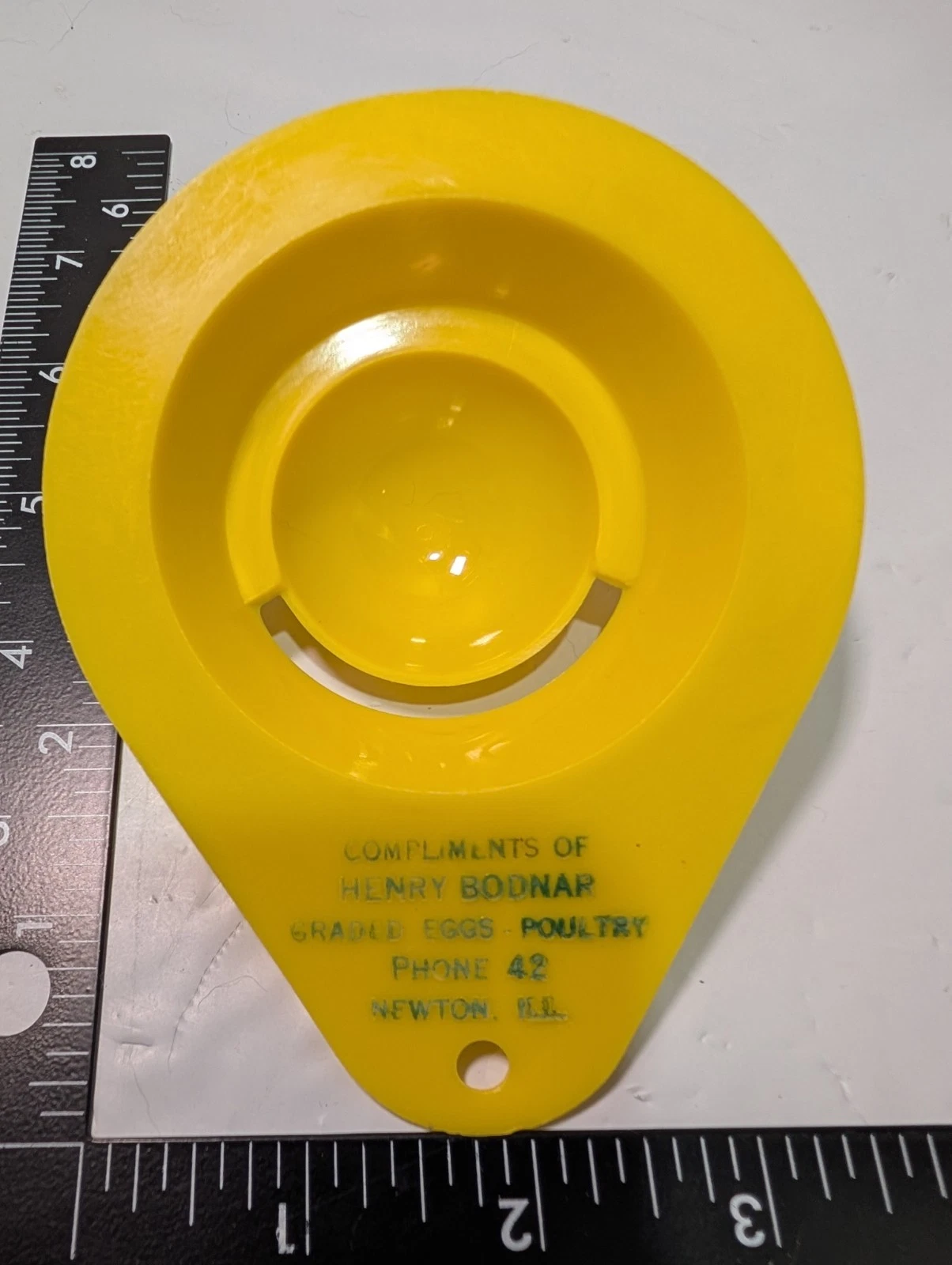 Henry Bodnar Poultry advertising egg separator - Yellow w green print - Plastic