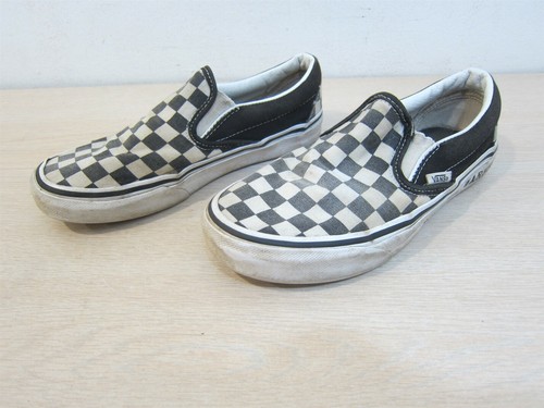 warped checkered vans