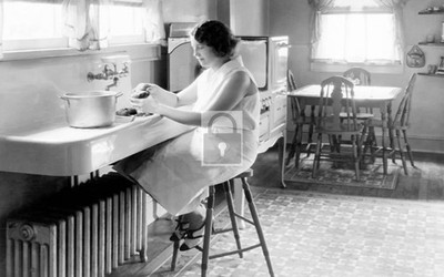 Interior View Woman Peeling Potatoes In Kitchen - Reprint