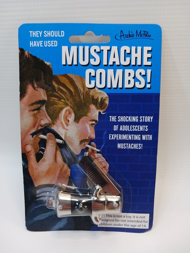 Deadstock novelty mustache combs still on their original retail card — a tiny, perfect time capsule of mid-century gag humor.