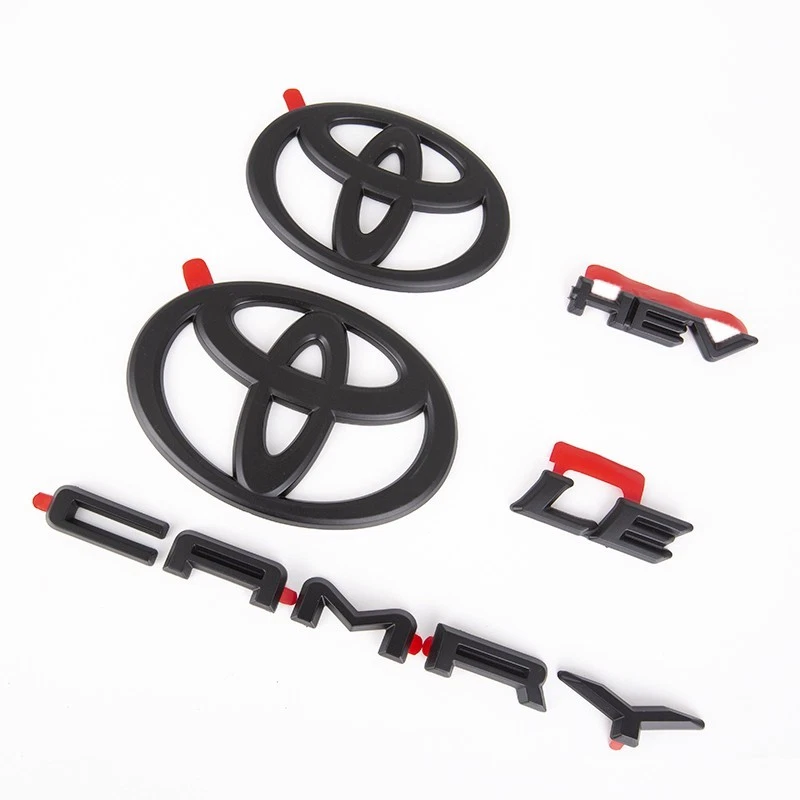 NUEVO OEM TOYOTA 2025+ CAMRY HYBRID LE HEV BLACKOUT EMBLEMA SUPERPOSICIONES CONJUNTO Foto 2 de 4