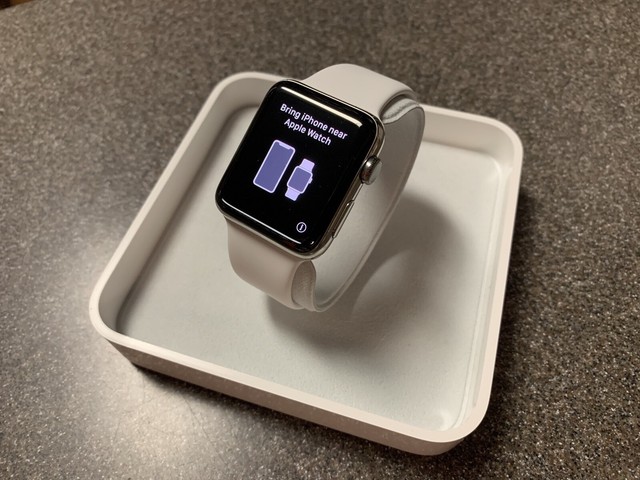 stainless steel case with white sport band