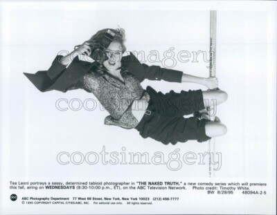 1995 Press Photo Pole Swinging Tea Leoni With Camera Naked Truth TV | eBay