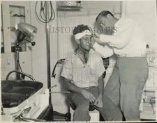 1939 Press Photo Dr. Philip J. Pollack treats injured workman Dominick Lofaro