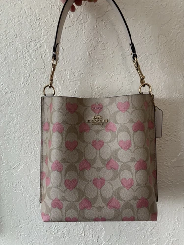 Borsa a secchiello Coach Mollie usata 22 in tela firmata con stampa cuore CP056
