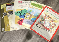 Lot of Alfred piano teaching books.