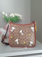 Coach X Peanuts Dempsey File Bag In Signature Canvas With Snoopy Woodstock Print