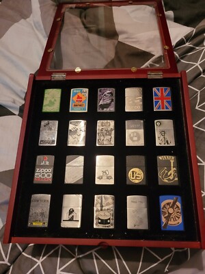 43 Zippos Genuine Refillable Cigarette Lighters, New With case to store them 