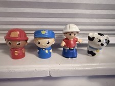 Lot of 4 Mega Bloks Figures - Firefighter, Police Officer, Builder, Dog