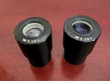 PAIR 2 OF WF.10X MICROSCOPE EYEPIECES. NO CRACKS OR CHIPS. WORKS