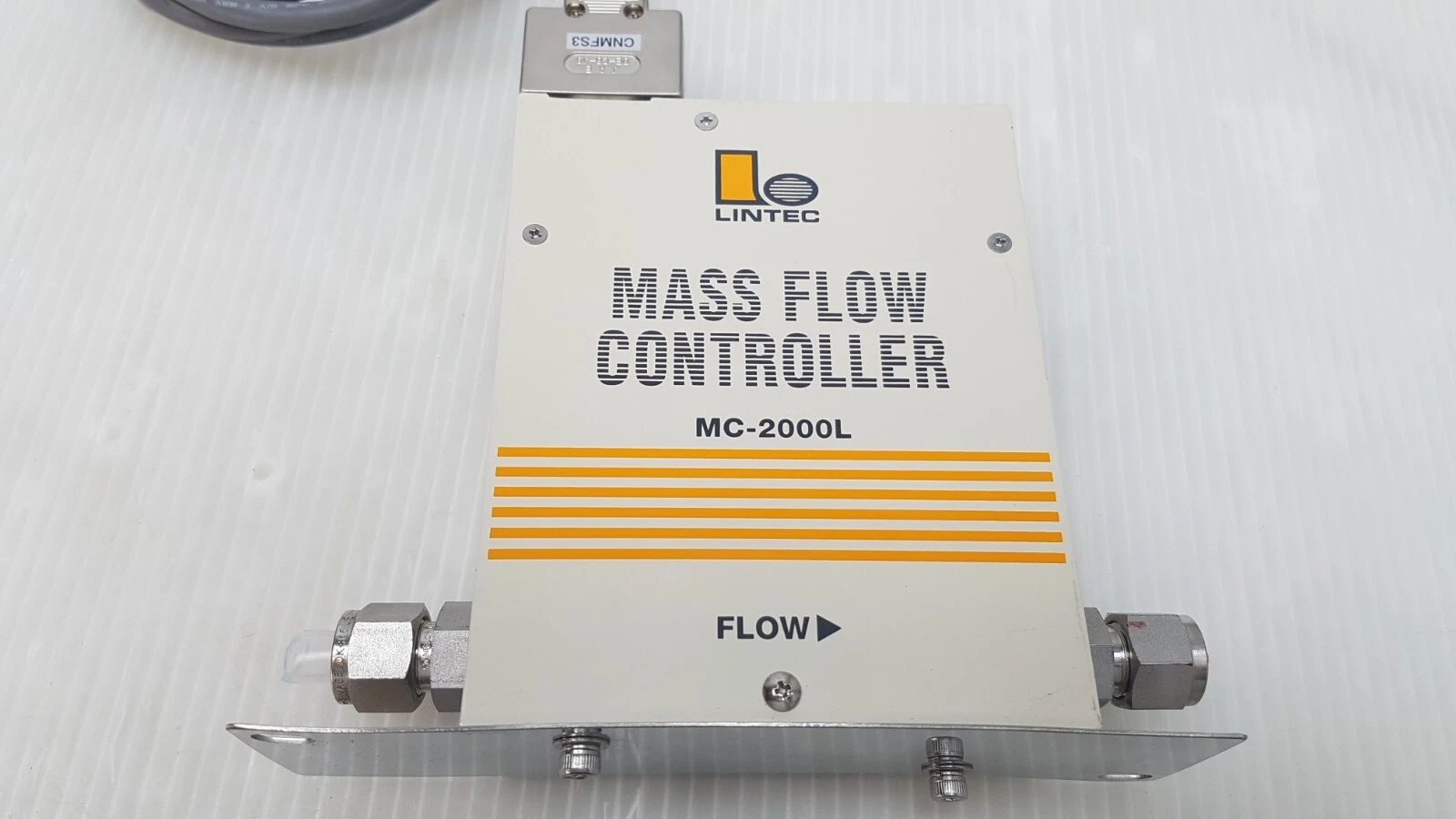 Front cover of the LINTEC MC-2000L mass flow controller with capped tube fittings