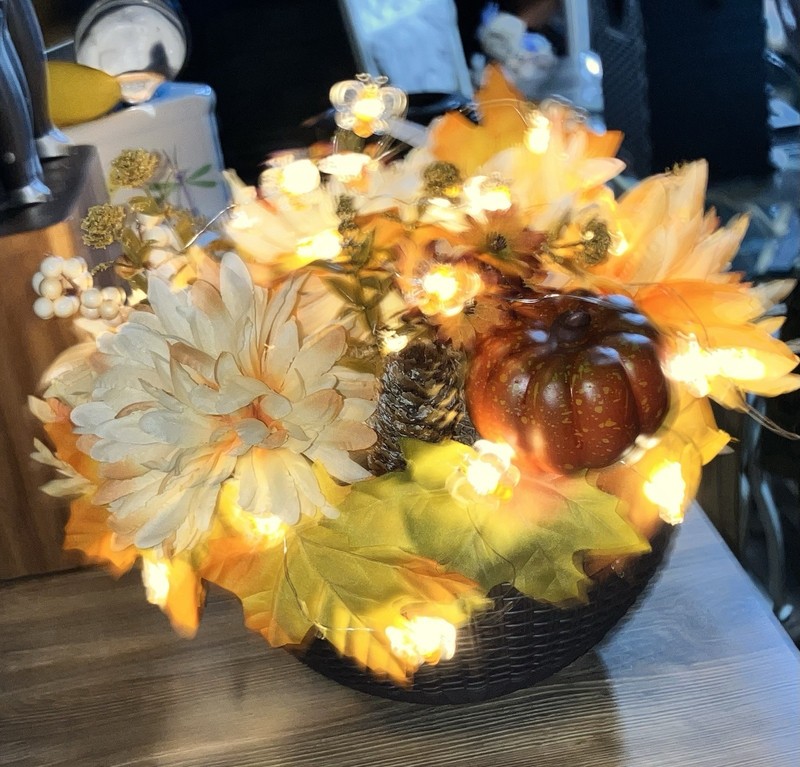Handmade Floral decoration Adorned with  a light glow of bees.