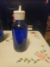 4 Cobalt blue glass bottles with a pour spout