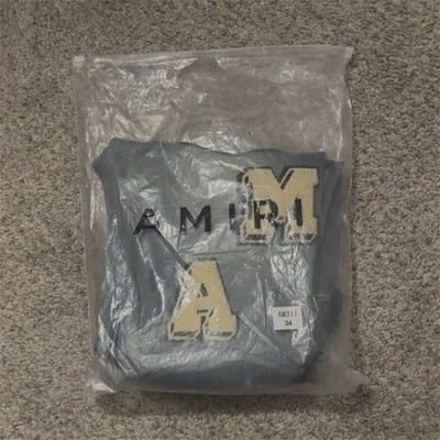 AMIRI Men s Blue Medium Wash Distressed Logo Patch Skinny Slim Jeans