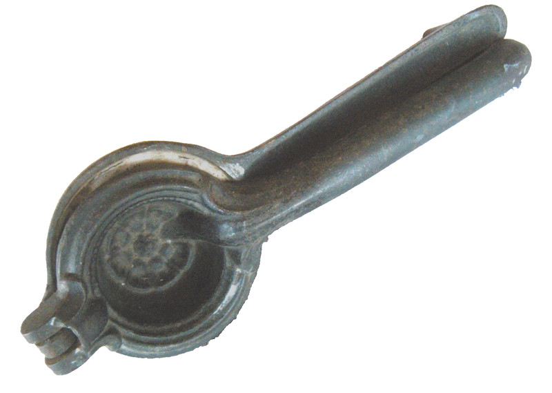 Unusual cast iron lemon squeezer w/white ceramic cup & plunger -later 1800's