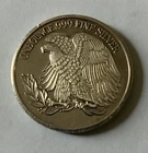 silver round (1 oz) depicting WWI memorial (tarnished)
