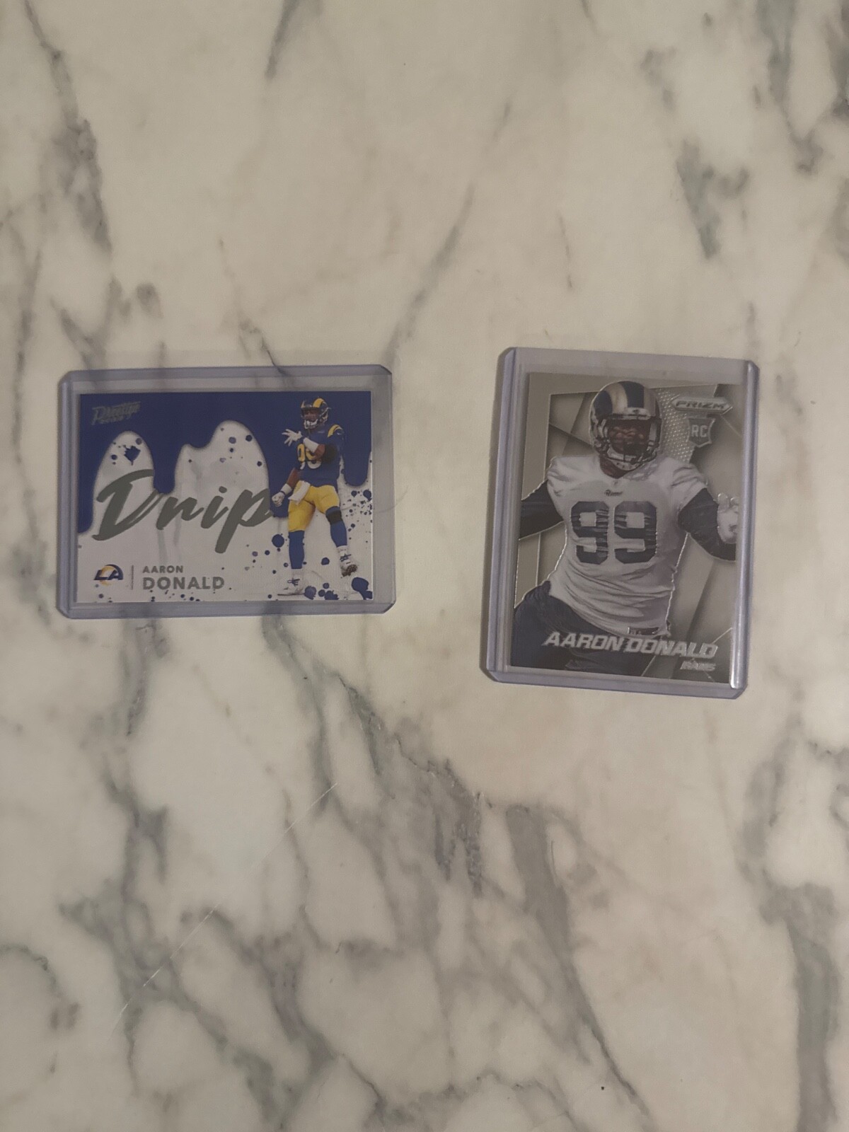2 Aaron Donald card including prizim base rookie card and ssp 2022 prestige Drip