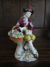 DRESDEN SITZENDORF 12.5cm  YOUNG MAN seated  FLOWER SELLER (4223)