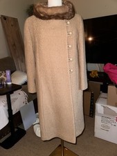 Vintage 1950s boucl wool coat featuring a plush mink fur collar mid-century