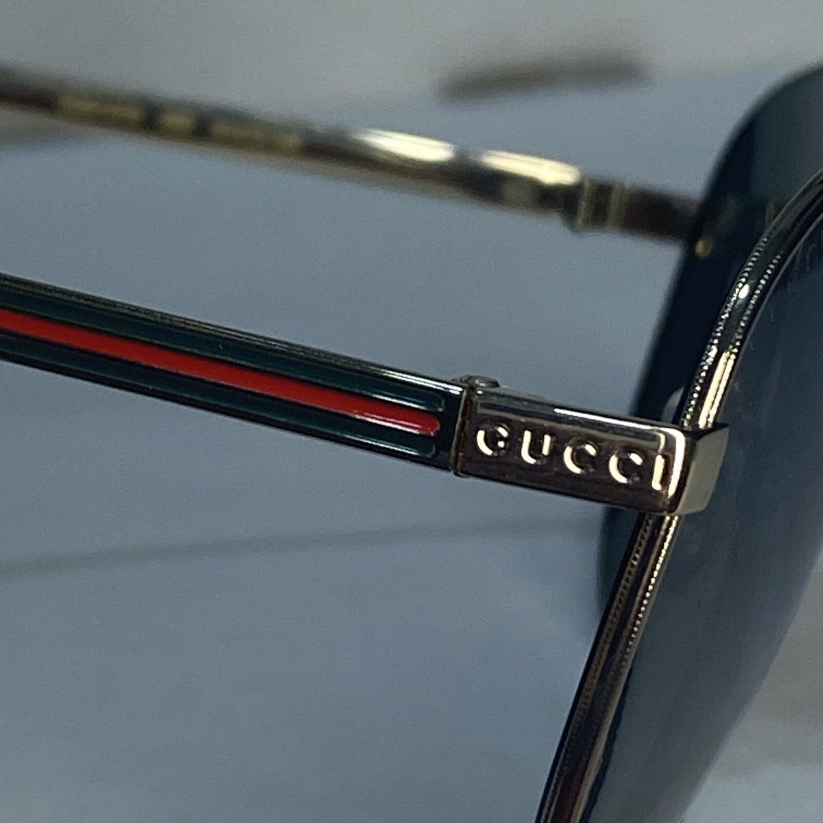 ? - New unisex Authentic Gucci GG0137S is a perfect choice of Sunglasses Buy Gucci Men,Women GG0137S 61 Gunmetal/Green Sunglasses  main image 3
