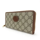 Portefeuille long Gucci d'occasion 673003 imbriqué G GG toile suprême beige marron gol