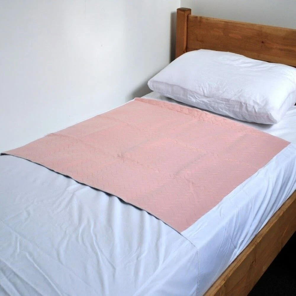 Washable Incontinence Set 2 x Pink Bed pads with tucks,1 x mattress protector.