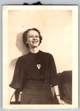Vtg B&W Snapshot Smiling Woman In Dark Top With Heart Pin Skirt Interior 1936