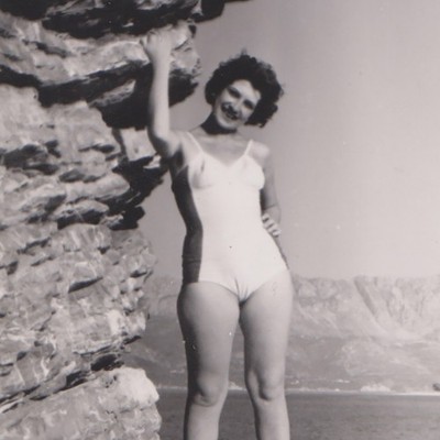 Smiling Swimsuit Beauty Posing By Rock Wall And Open Sea Summer Vintage Photo