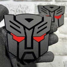 Fender Badges 2x Autobot Transformer Mask Car Emblem EYE COLORS Badge Decal
