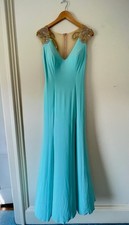 Worn as prom gown. Tony Bowls. Light blue/mint green. Worn once. Originally 500