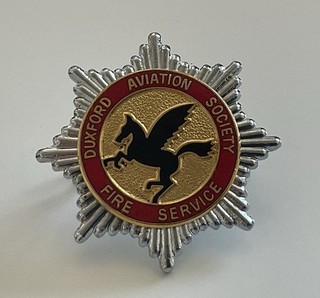 An obsolete original Duxford Aviation Society Fire Service Cap Badge.