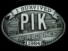 UA05139 VINTAGE 1984 I SURVIVED PIK AGRIBUSINESS COMMEMORATIVE BELT BUCKLE