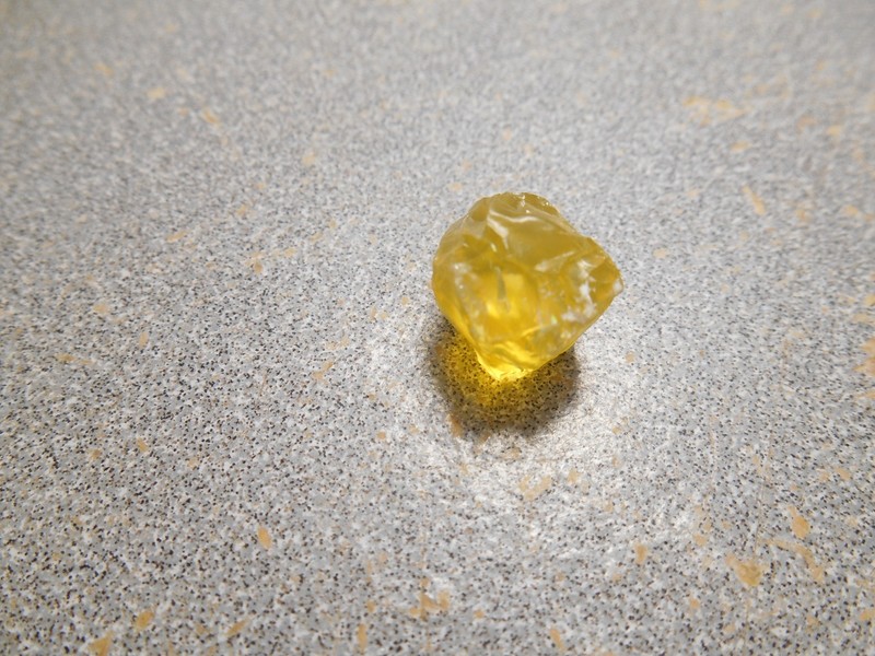 Opal faceting rough. Bright Canary yellow. 7.2 cts. clean. Tanzania.