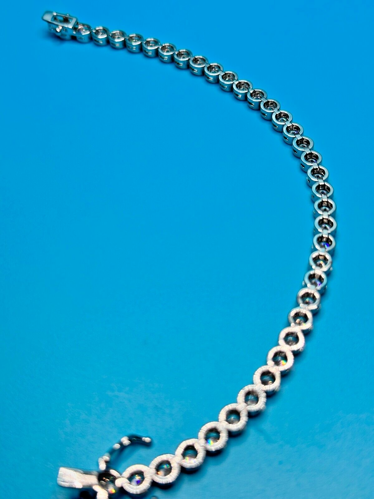 JCM Tennis Style Bracelet CZ Colorless Safety Latch Silver Tone Signed