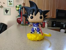 goku sitting on nimbus pop