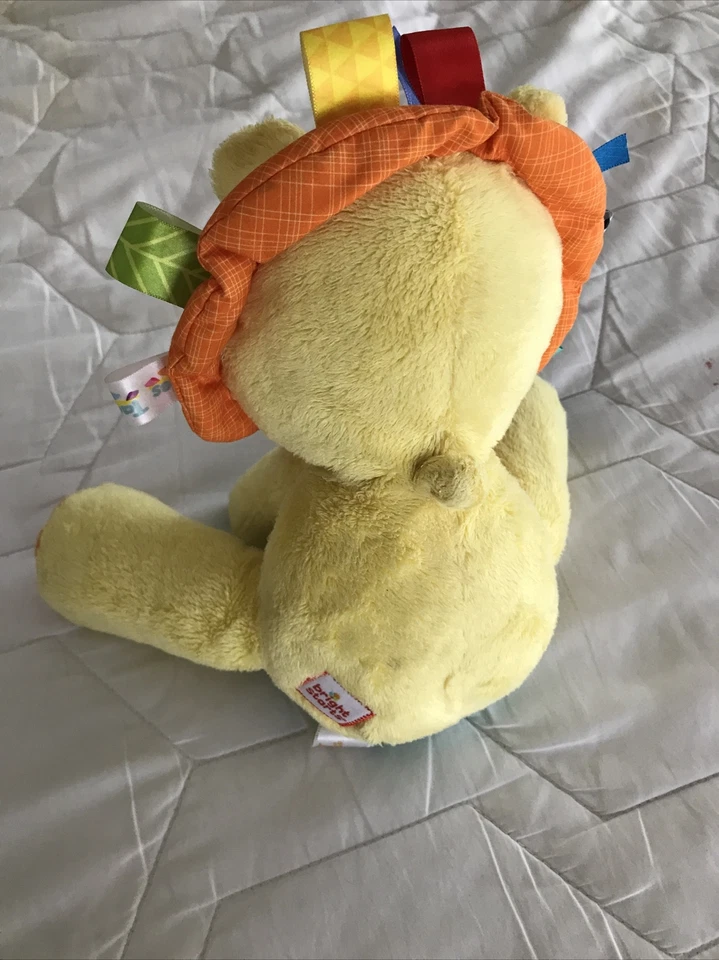 Juguete suave amarillo táctil para bebé Bright Starts Lion animal de peluche Taggies guardería 9” Foto 4 de 4